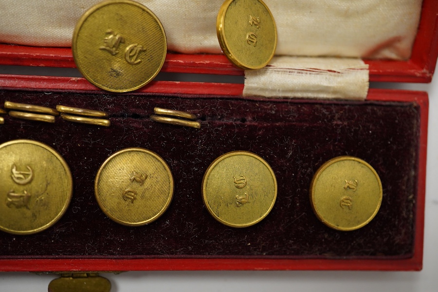 A set of 22 late 19th century gilt brass 'M.C.' (Merton College, Oxford) buttons. Condition - good